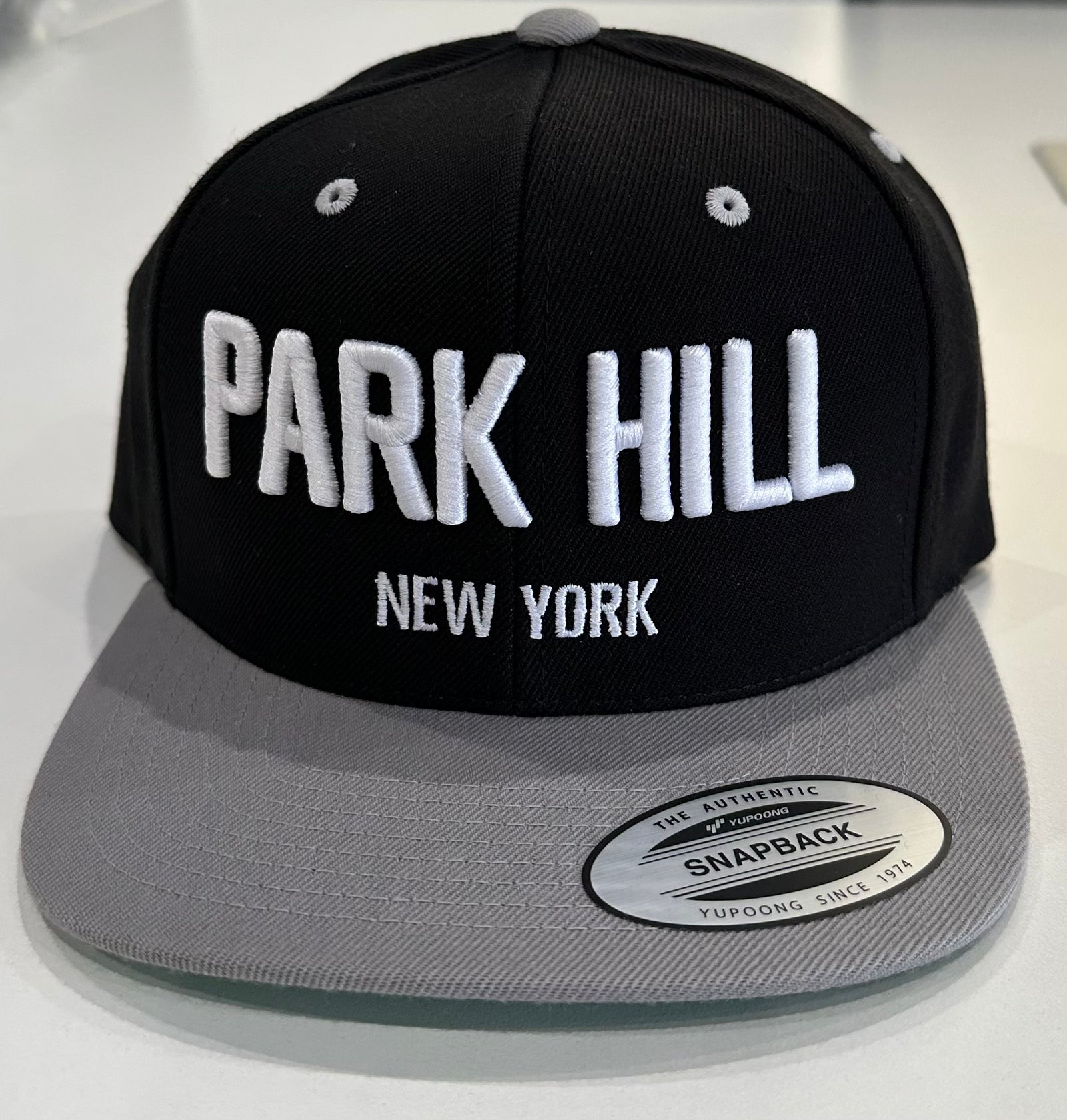 Black Snapback w/ Grey Bill and White Print